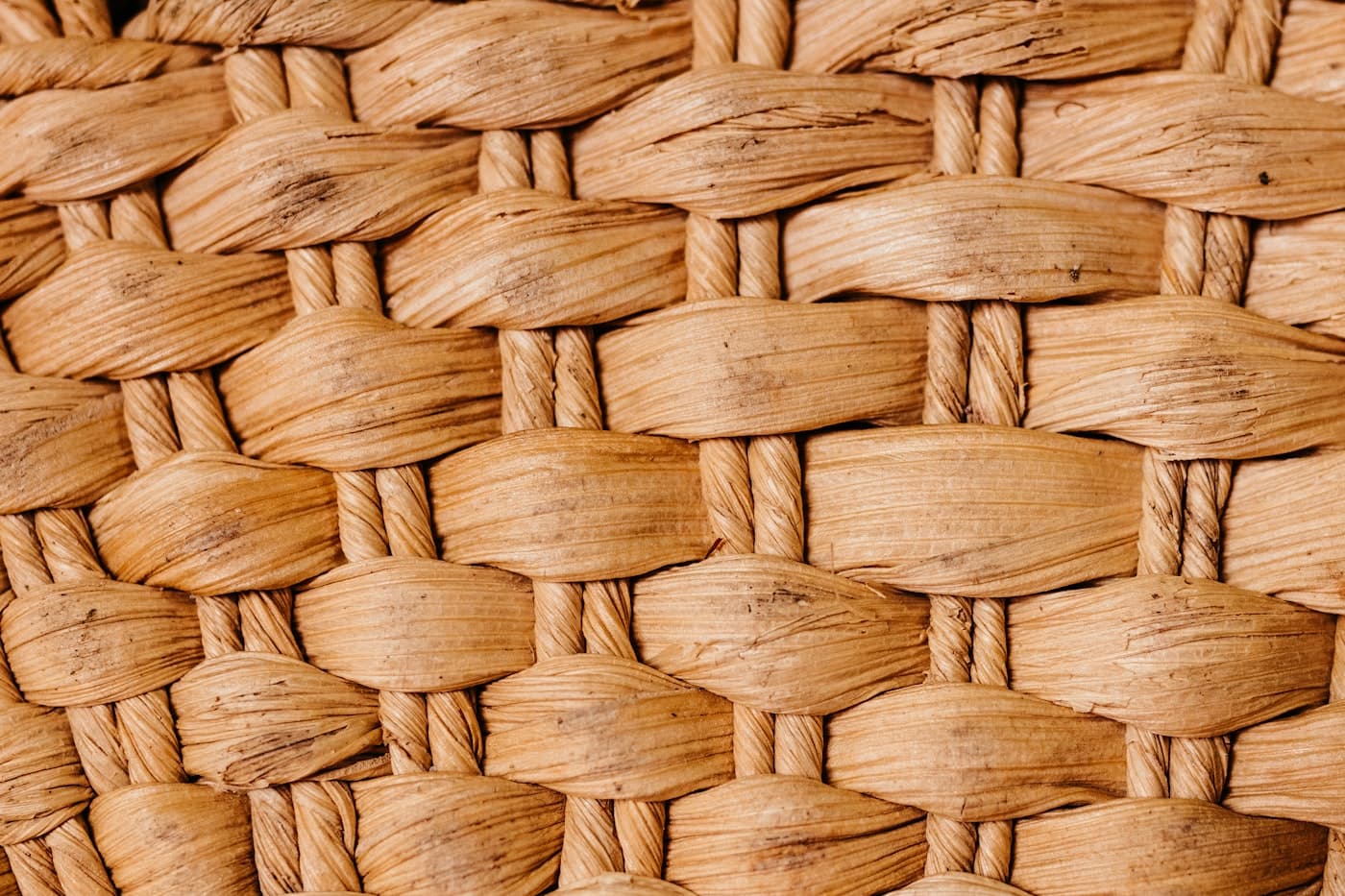 Macro view of tightly packed natural rush weave.